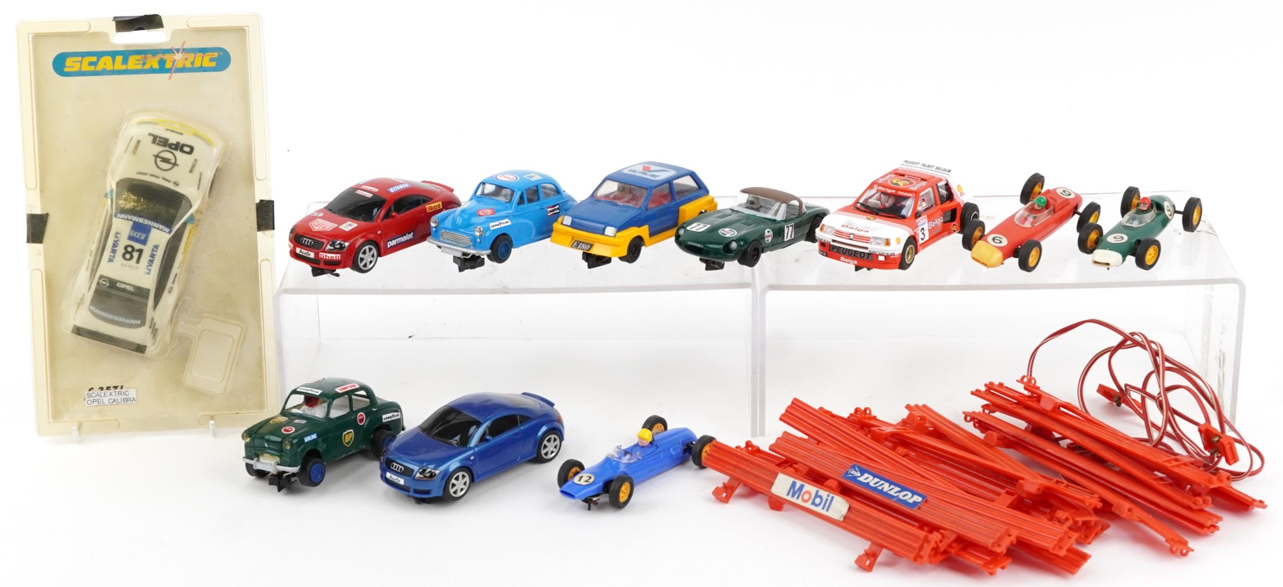 Eleven vintage and later slot cars and accessories including Scalextric and Hornby