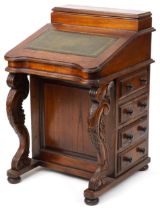 Stained hardwood Davenport with tooled leather top, fitted interior and four side drawers opposing