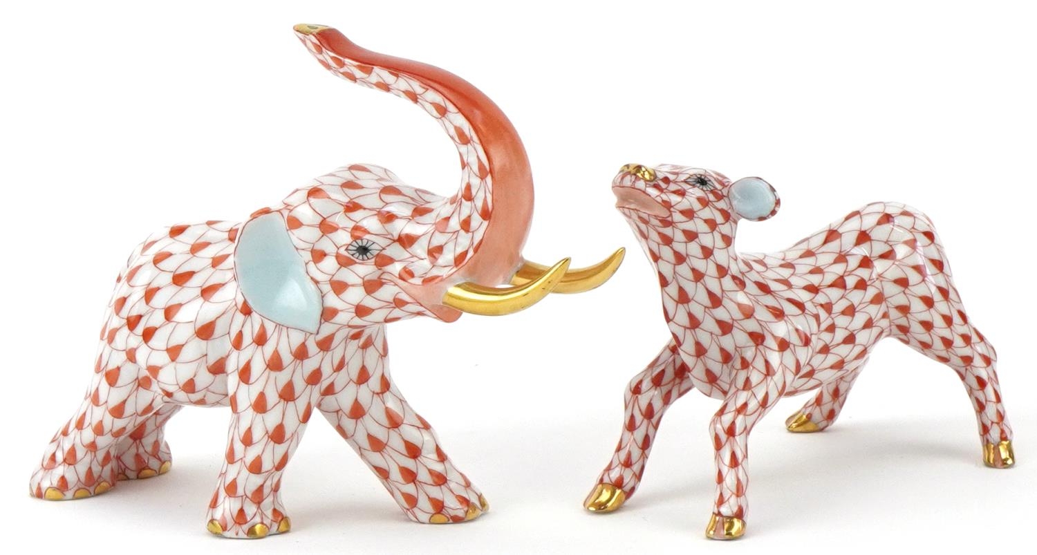 Herend, Hungarian hand painted porcelain fishnet pattern elephant and a calf, the largest 13.5cm