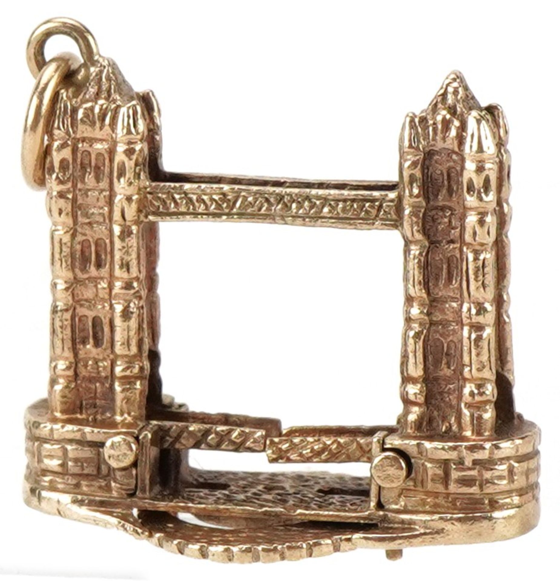 Large 9ct gold charm in the form of London Tower Bridge with rise and fall bridge, 2.2cm high, 7.4g