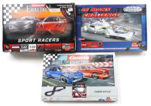 Three Carrera and Carrera Evolution 1:32 scale model slot car racing sets comprising Sport Racers