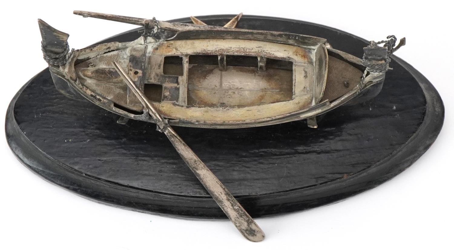 Maltese unmarked silver model of a fishing boat raised on an ebonised wood stand, overall 14cm in - Image 4 of 5