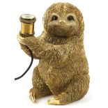 Ornate gilt painted table lamp in the form of a sloth, 30cm high