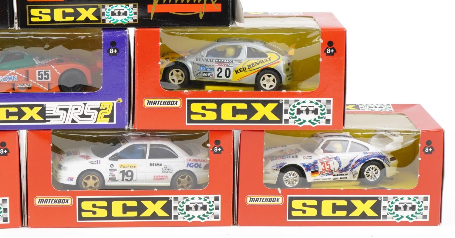 Ten Matchbox SCX 1:32 scale model slot cars with boxes and cases including Subaru Impreza, Porsche - Image 4 of 4