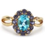 9ct gold blue topaz and purple stone cluster ring with split shoulders, the topaz approximately 8.