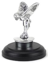 Automobilia interest silvered metal Spirit of Ecstasy raised on a circular ebonised base, 14.5cm