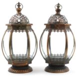 Pair of partially gilt bronzed hanging lanterns, each 50cm high