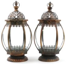 Pair of partially gilt bronzed hanging lanterns, each 50cm high
