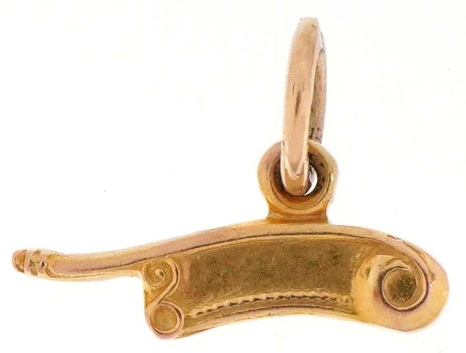 9ct gold charm in the form of bosun's whistle, 1.4cm wide, 0.5g