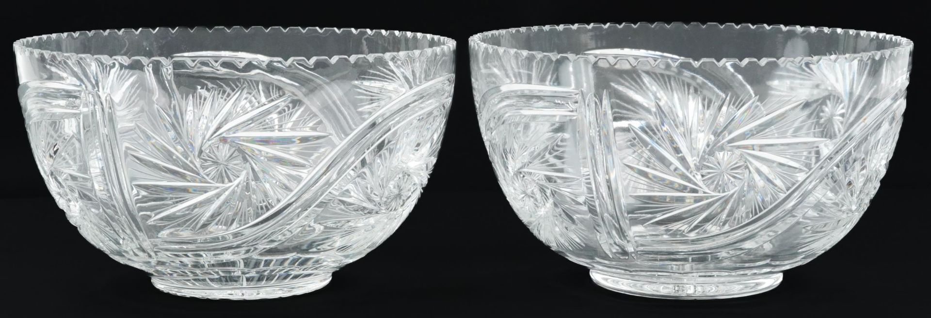 Large pair of good quality glass bowls cut with wheel design and star bases, each 29cm in diameter