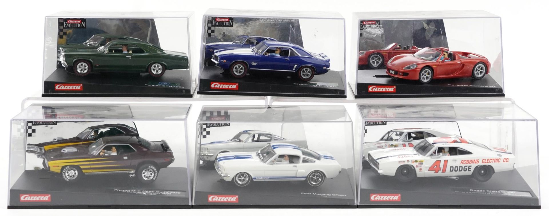 Six Carrera Evolution slot cars with cases comprising Dodge Charger 500, Porsche Carrera GT,