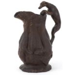 Victorian Wilhelm Schiller & Sons pottery hunting jug with greyhound design handle, 19cm high