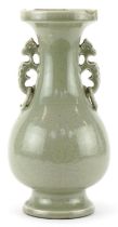 Chinese porcelain vase having a celadon glaze with animalia ring turned handles, incised