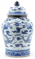 Large Chinese Kangxi jar and cover hand painted with a dragon chasing the flaming a pearl, 66cm high