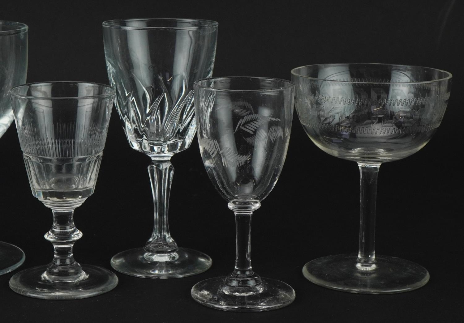 Eight antique and later wine glasses including a rummer with edged heraldic crest, the largest - Image 3 of 3