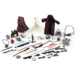 Selection of Star Wars figure accessories including capes and guns, the largest 8.5cm
