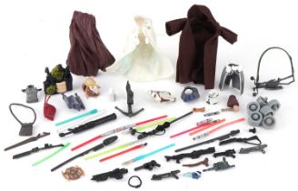 Selection of Star Wars figure accessories including capes and guns, the largest 8.5cm