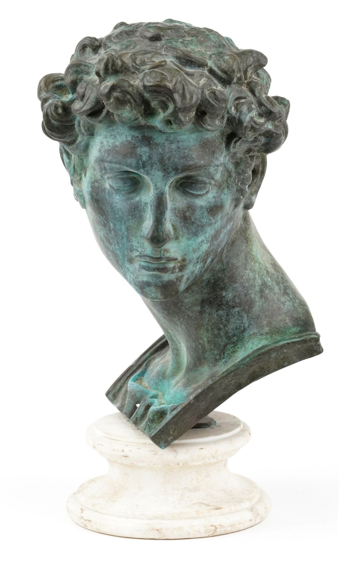 After the Antique, patinated bronze head of David of Michelangelo raised on a circular white