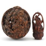 Chinese walnut carved with figures and a Japanese boxwood netsuke carved with three rabbits in a