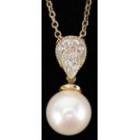 9ct gold cultured pearl and diamond pendant on a 9ct gold necklace, 1.9cm high and 44cm in length,