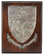 Early 20th century white metal heraldic shield on oak back with Fisher of Birmingham plaque to the