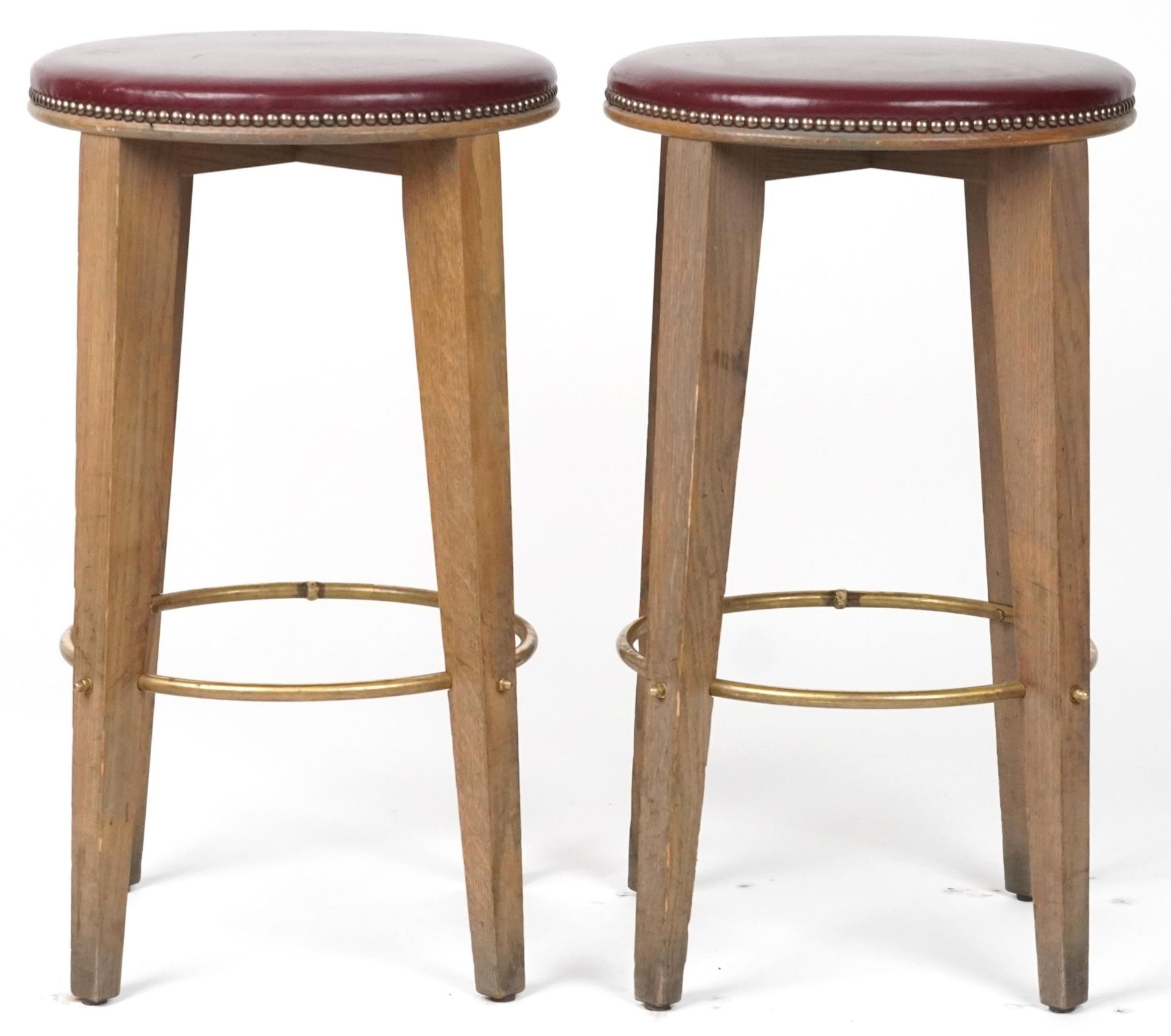 Pair of contemporary breakfast bar stools with burgundy leather upholstered padded seats, each