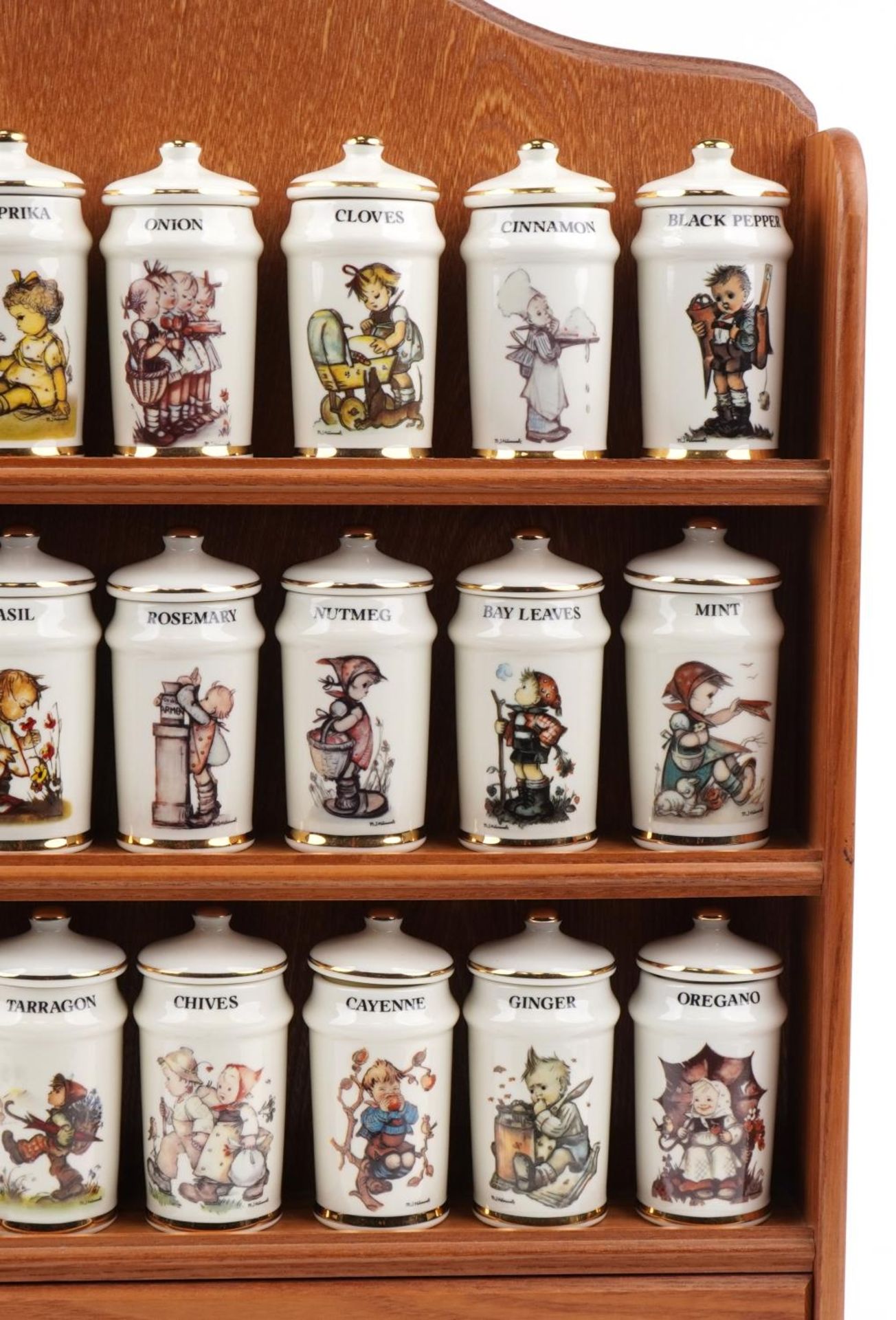 Collection of M J Hummel porcelain spice jars and covers arranged in a lightwood spice rack, each - Image 3 of 5