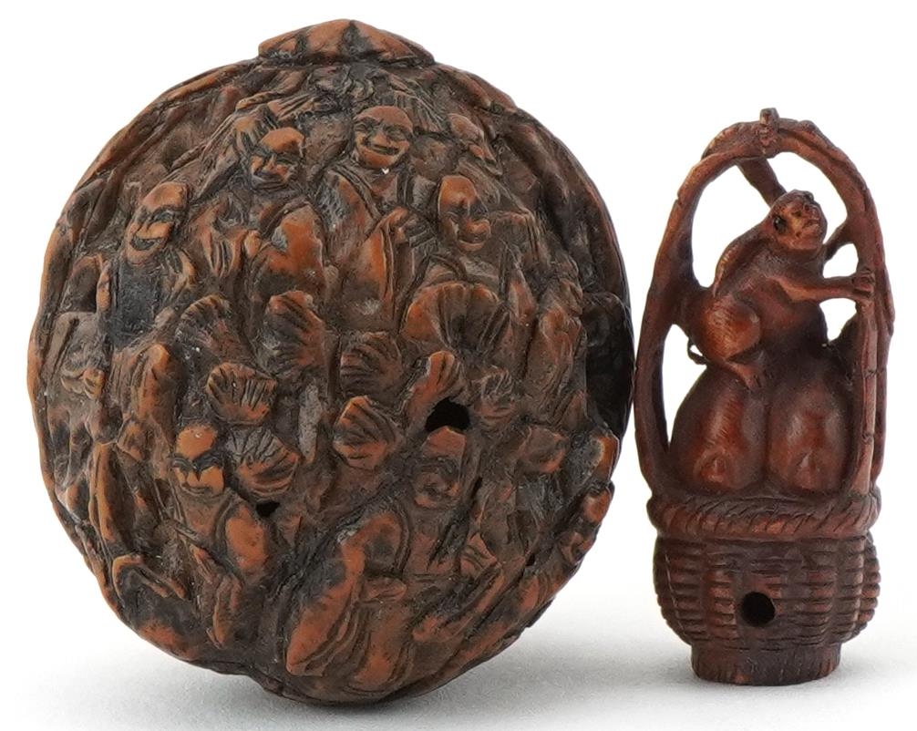 Chinese walnut carved with figures and a Japanese boxwood netsuke carved with three rabbits in a - Image 2 of 3