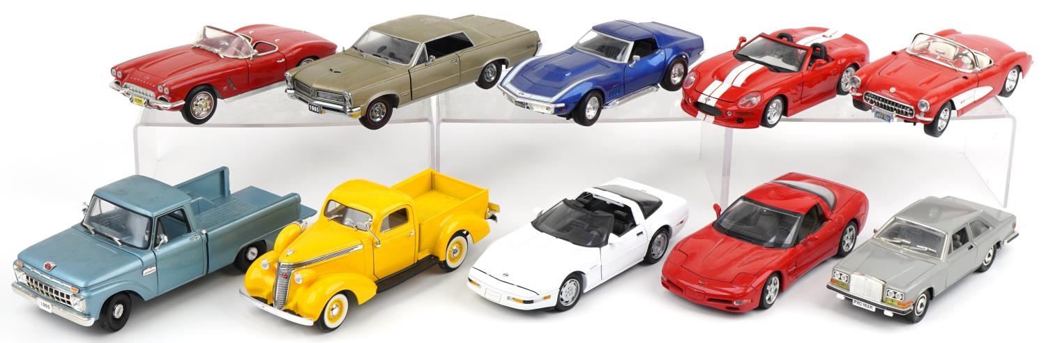 Ten 1:18 scale diecast vehicles including Ertl 1962 Corvette, Burago 1999 Shelby Series 1 and Sun