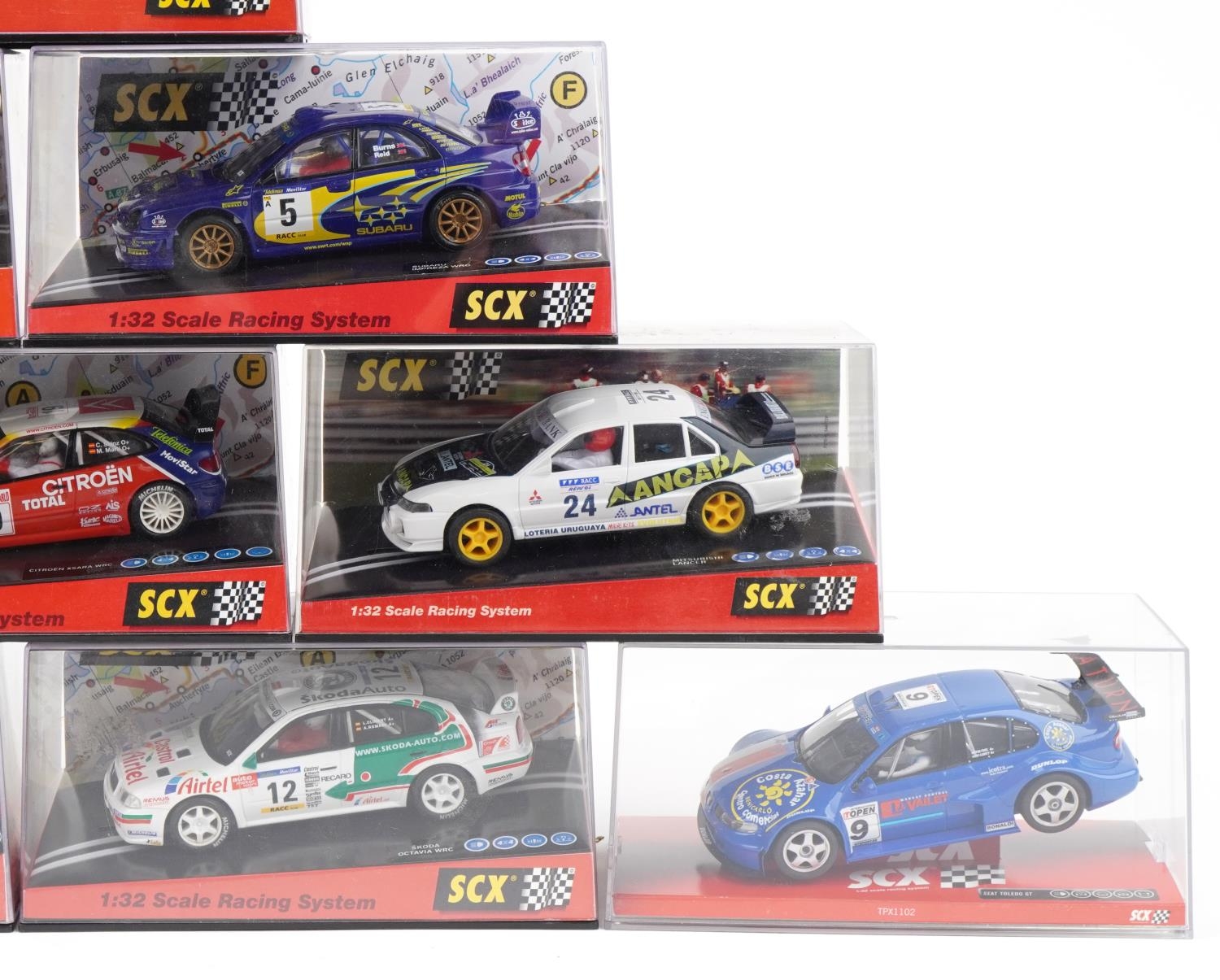 Ten Matchbox SCX 1:32 scale model slot cars with cases including Citroen C2, Mitsubishi Lancer and - Image 3 of 3