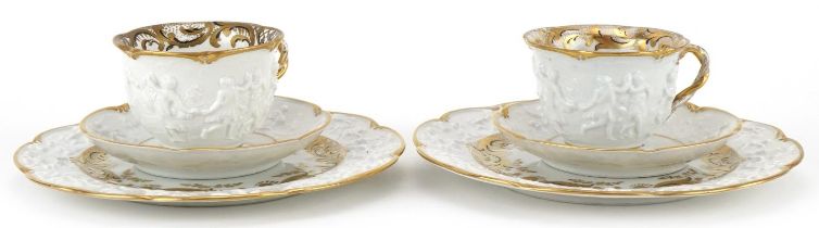 Pair of 19th century Neapolitan porcelain Napoleon and Josephine trios with armorial crests, the