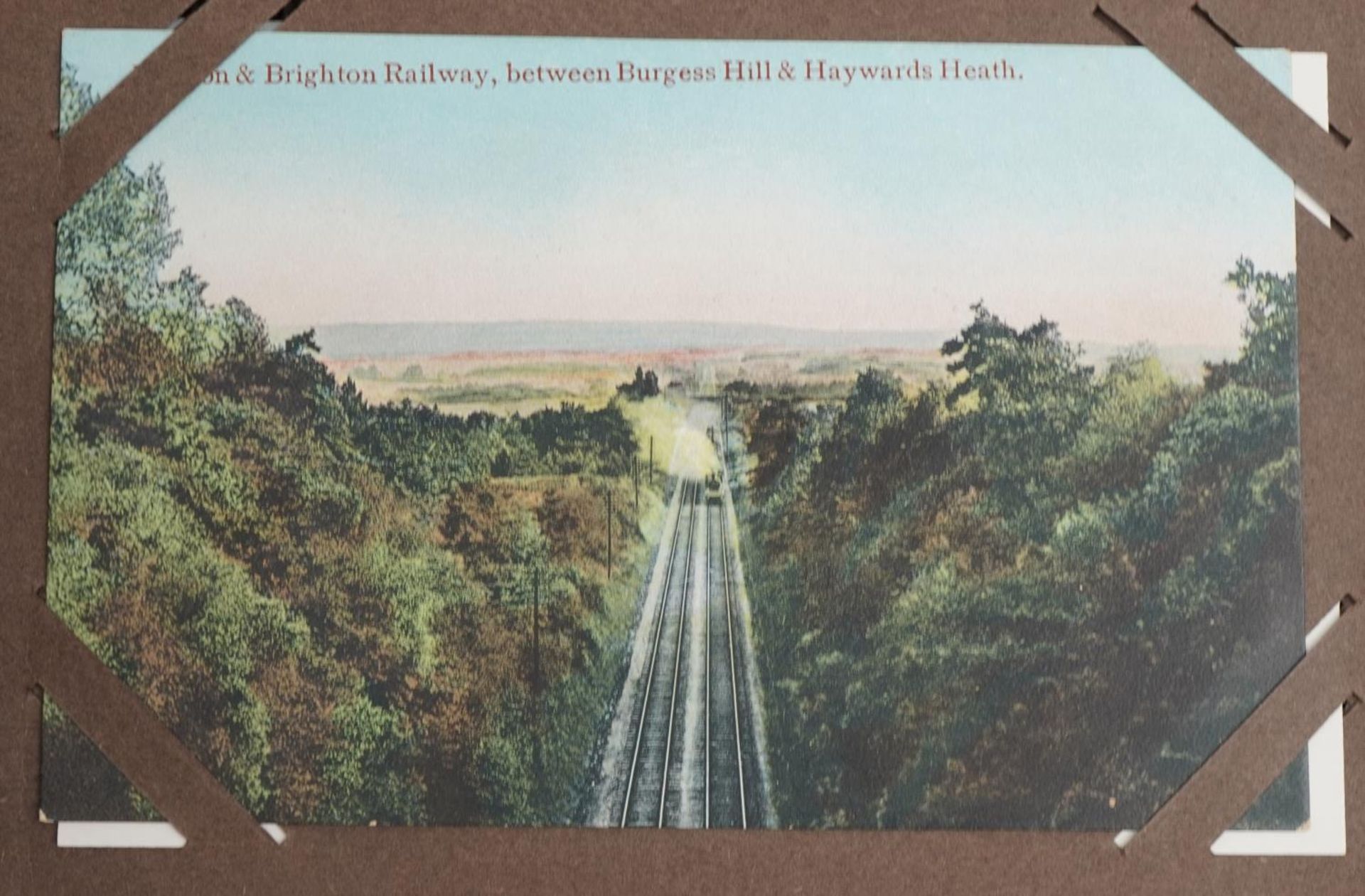 Local interest and railwayana postcards arranged in an album including Eastbourne Railway Station - Image 5 of 13