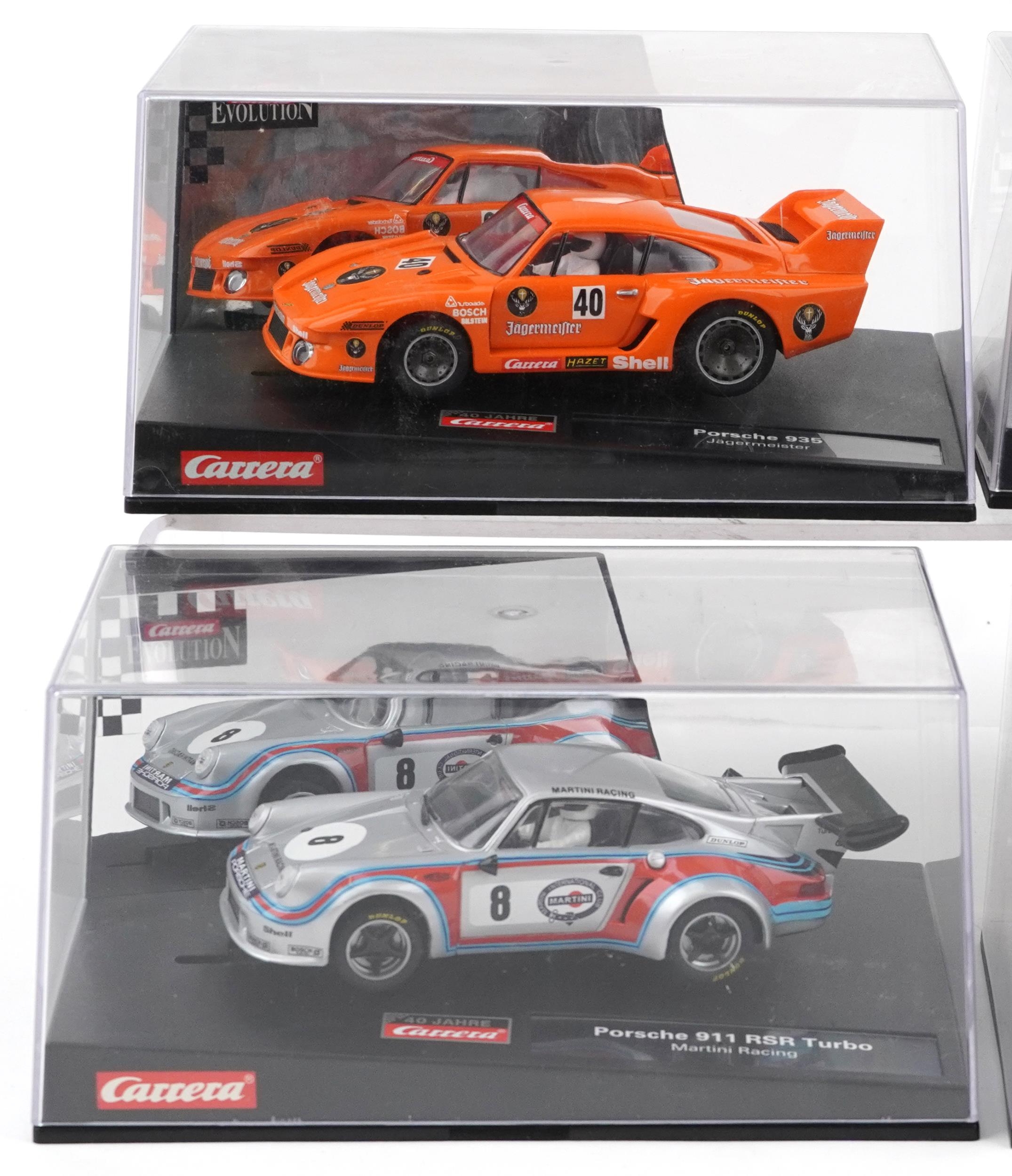 Six Carrera Evolution slot cars with cases comprising Porsche 935, Aston Martin V12 Vanquis, Audi A4 - Image 2 of 3