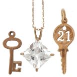 9ct gold jewellery comprising cubic zirconia pendant on necklace and two charms in the form of keys,