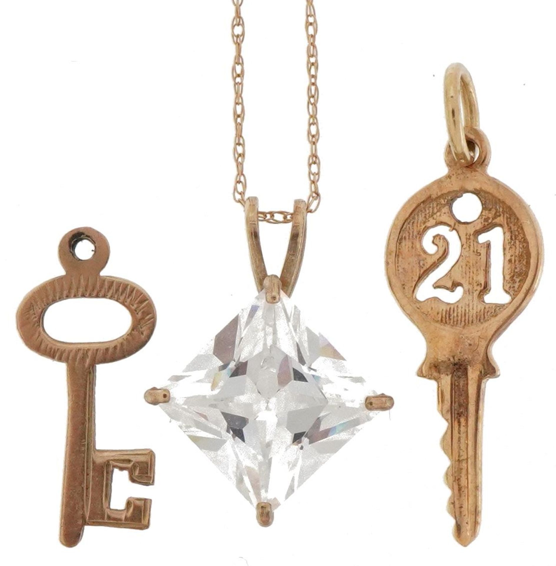 9ct gold jewellery comprising cubic zirconia pendant on necklace and two charms in the form of keys,