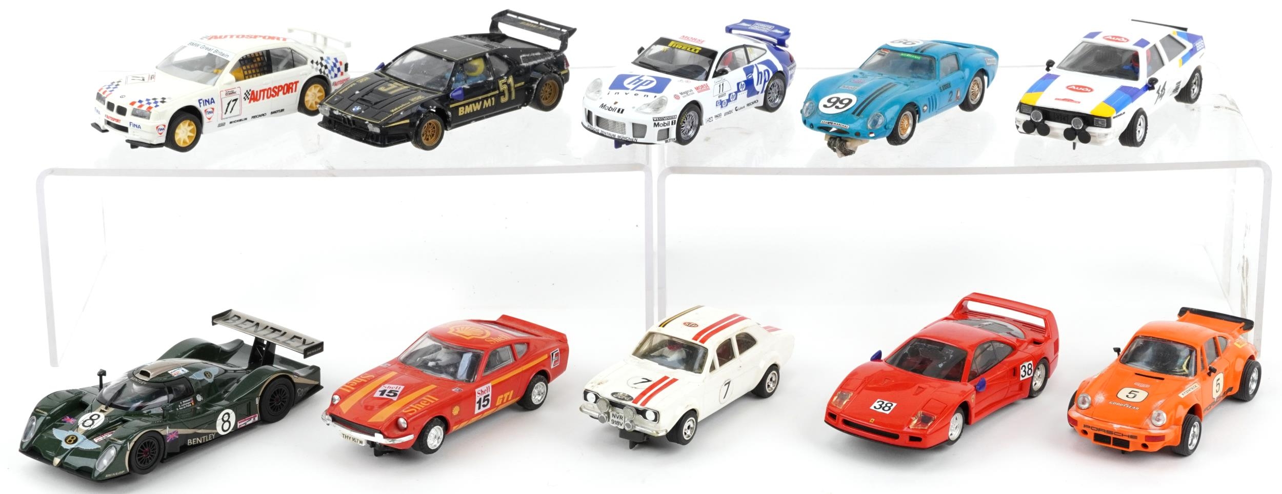 Ten vintage and later slot cars including Scalextric, Carrera Evolution and Hornby
