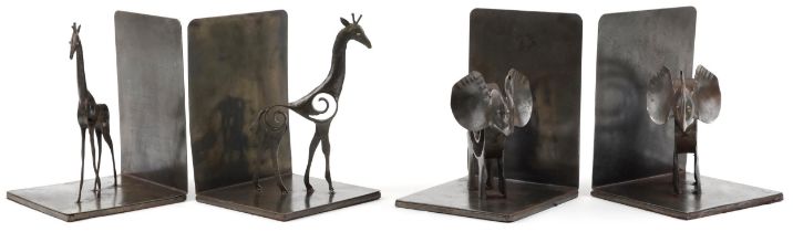 Two pairs of Modernist cast metal bronzed bookends comprising a pair with giraffes and a pair with