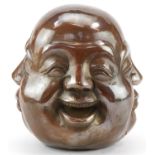 Chinese patinated bronze four face paperweight, 12cm high