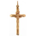 Unmarked gold crucifix pendant, tests as 9ct gold, 3cm high, 0.9g