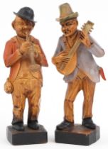 Pair of hand painted European carved wooden statues of musicians, each 15cm high