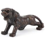 Japanese patinated bronze okimono of a tiger, 34cm in length