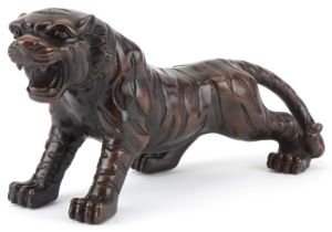 Japanese patinated bronze okimono of a tiger, 34cm in length