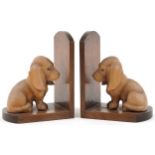 Pair of Art Deco mahogany and lightwood carved dog design bookends, each 18cm high