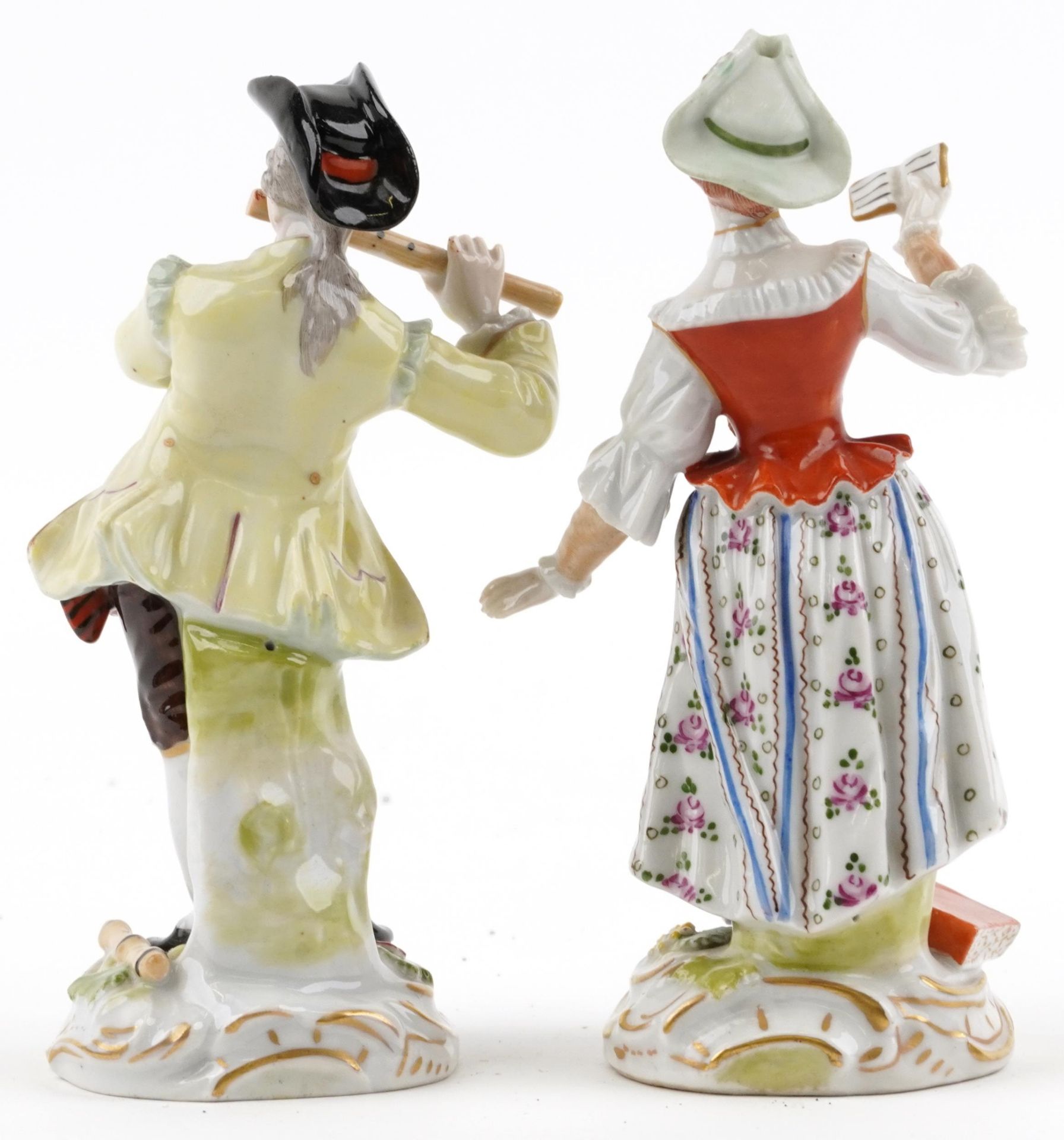 Pair of Dresden German porcelain figures of a female holding a book and a gentleman playing a flute, - Bild 2 aus 4