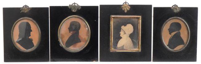 Three early Victorian silhouette pictures of gentlemen and a black and white picture of a lady