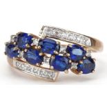 9ct gold blue spinel and diamond crossover cluster ring, size P, 2.8g