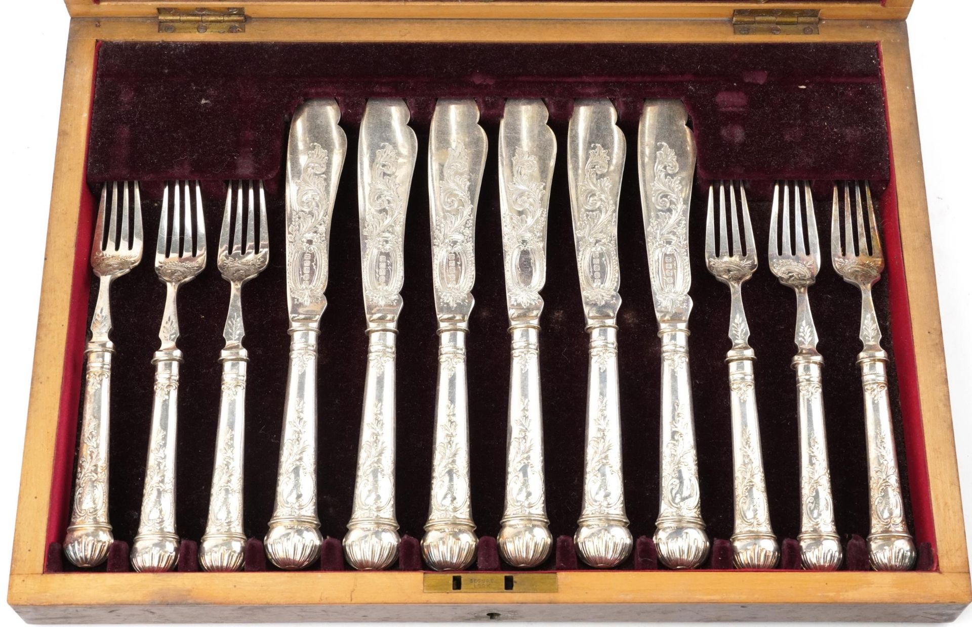Victorian twelve place canteen of silver plated fish knives and forks engraved and embossed with - Image 2 of 8