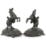 Pair of classical patinated spelter Marley horses with trainers, each 23.5cm high