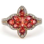 9ct gold garnet and diamond flower head ring, size Q, 2.6g