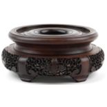 Chinese carved and pierced hardwood stand, 20cm in diameter